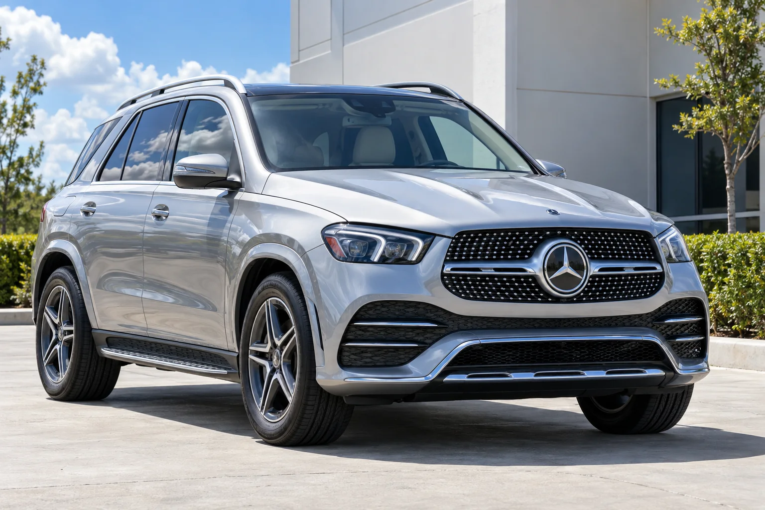 Silver Mercedes-Benz GLE with dark tinted side and rear windows in bright Florida sun