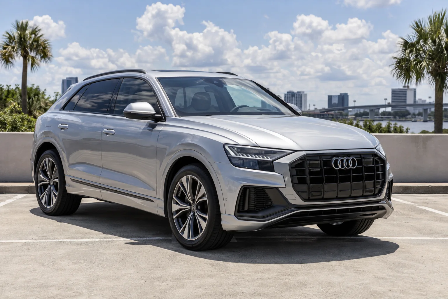 Silver Audi Q8 with ceramic window tint in bright sun